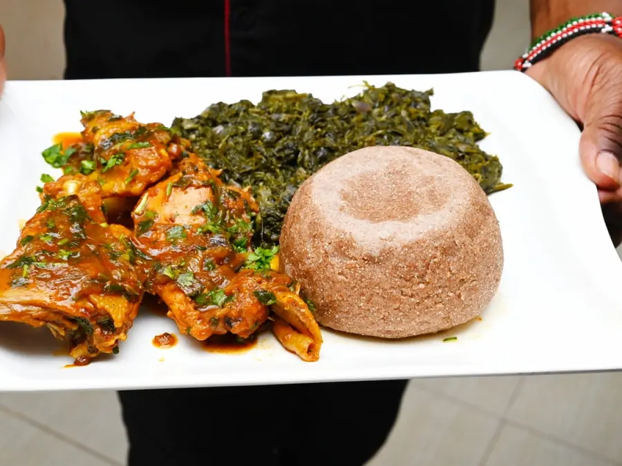 Chicken stew with greens and ugali