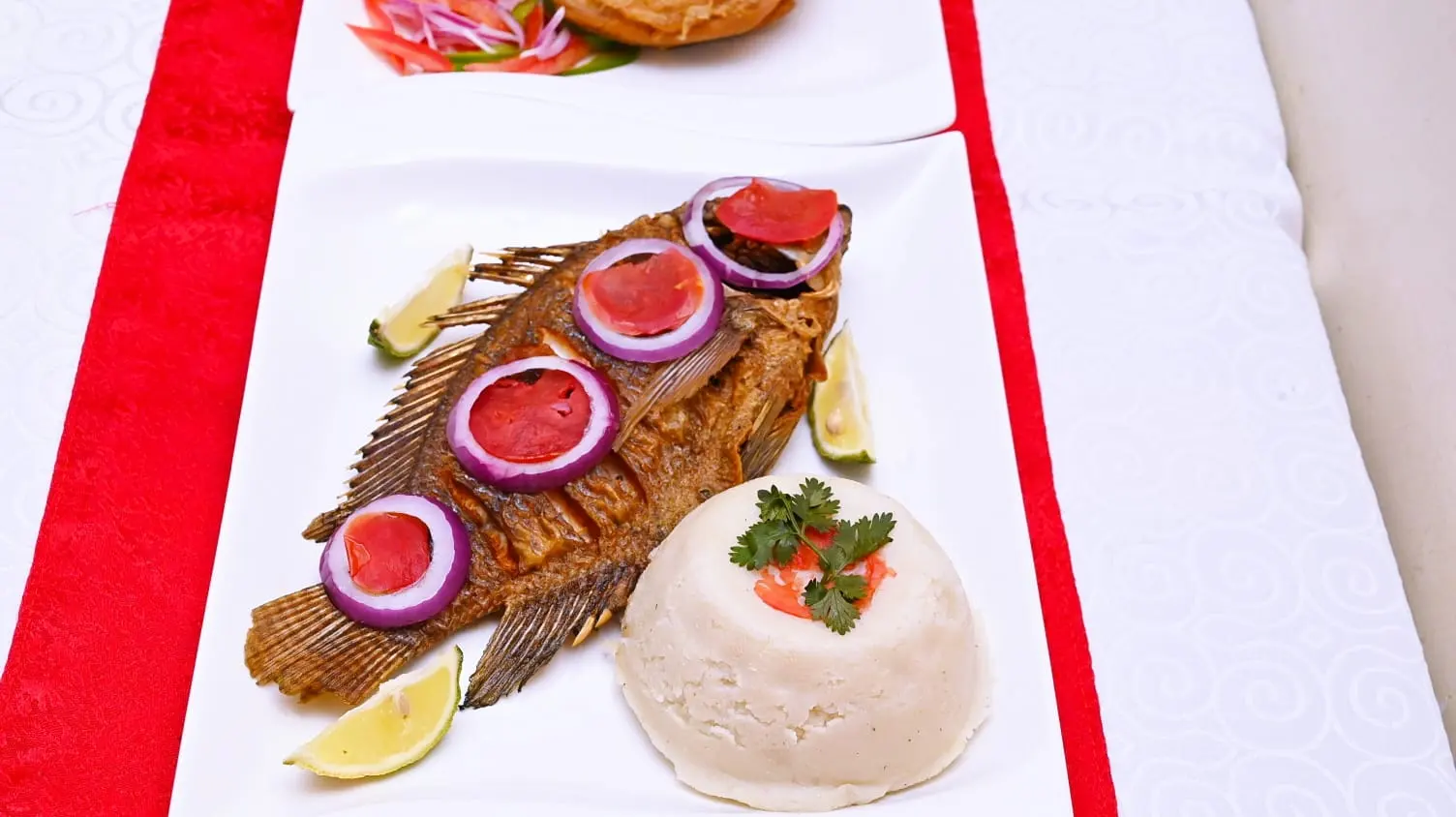 Whole fried tilapia with ugali