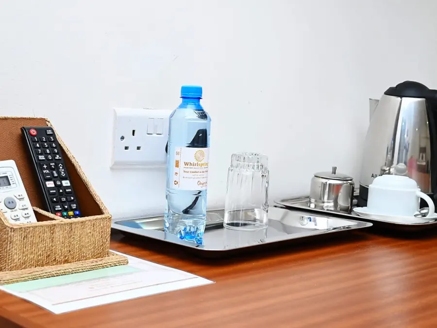 In-room tea tray, drinking water and remotes